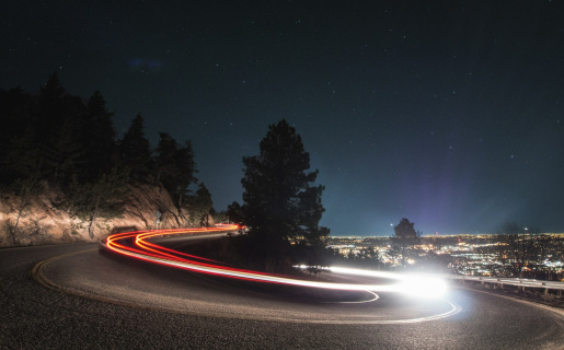 night time with a time lapse of a vehicle driving fast