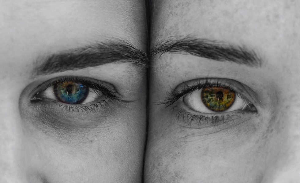 Two faces with different color eyes