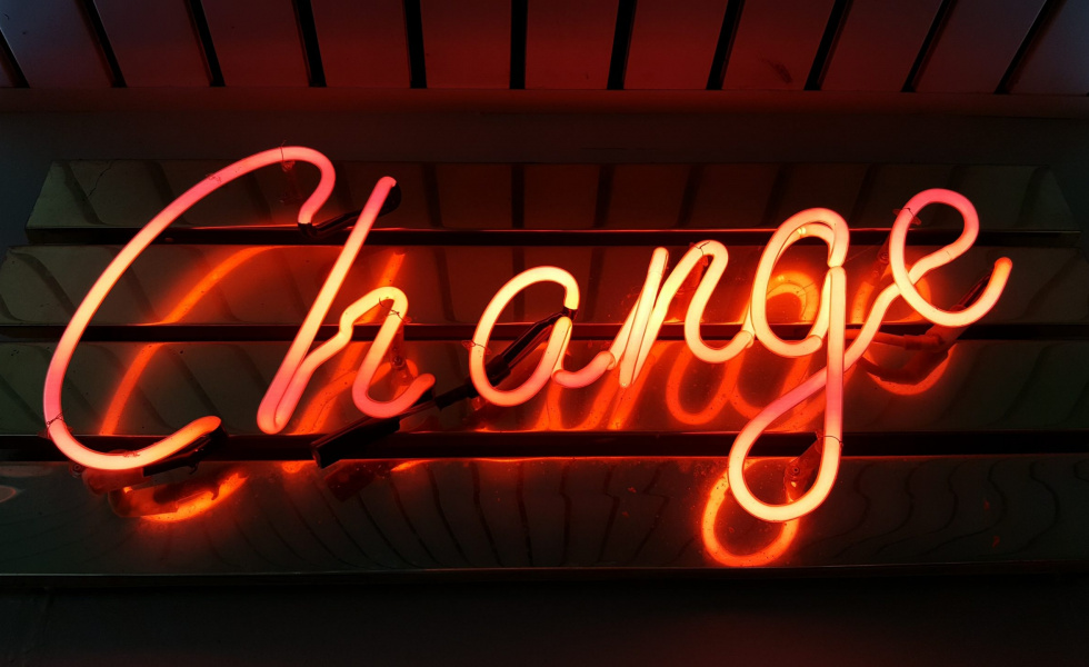 neon sign that says "change"