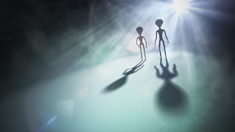 A creepy illustration of two alien silhouettes.